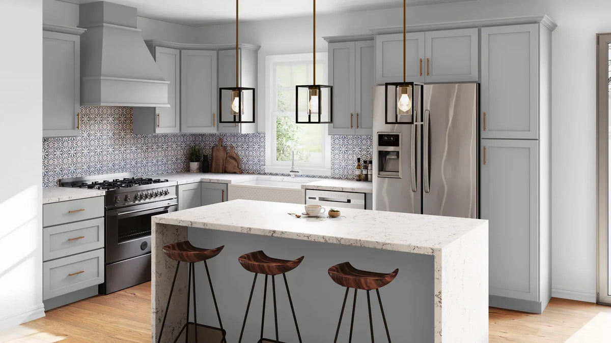 Bright kitchen with CNC Cabinetry white shaker cabinets, a center island and stone countertops